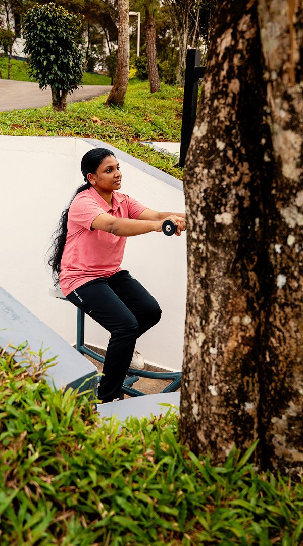 Resort in Munnar - Guest doing workout in outdoor gym